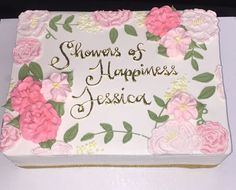 a sheet cake decorated with pink flowers and the words, shower of happiness to jesus