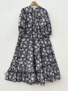 DESCRIPTION black floral printed summer style long maxi dress / Henley neckline with button maxi dress / 3/4th sleeve with button long maxi dress Indian (Jaipur) Traditional Hand Block Printed Dresses for summer vacations, beaches wear, party wear, and more occasions to wear this dresses. PRODUCT DETAILS: 3/4th sleeve, Henley neck, Long dress FABRIC: soft and breathable cotton cambric WASH CARE:  wash in cold water, air dry in shade.. SLEEVE LENGTH - 18 inch Size chart is mentioned in images. Size chart is given of the garment not the person wearing the garment We will be happy to customize according to your measurements. Message us for custom wholesale orders. Color of given picture may slightly vary due to sunlight, screen's resolution and camera focus. also you can write for more inform Printed 3/4 Sleeve Maxi Dress For Beach, Printed 3/4 Sleeve Maxi Dress For Vacation, Printed Maxi Dress With 3/4 Sleeve For Vacation, Casual Floral Print Maxi Dress With 3/4 Sleeve, Casual Maxi Dress With Floral Print And 3/4 Sleeve, Black Floral Print Floor-length Maxi Dress, Floral Print Maxi Dress With 3/4 Sleeves, Floral Print Flowy Maxi Dress With 3/4 Sleeves, Bohemian Floral Print Maxi Dress With 3/4 Sleeves