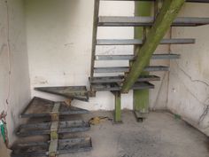 an old rundown building with some stairs