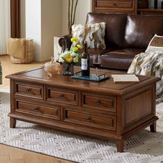 a living room filled with furniture and a coffee table