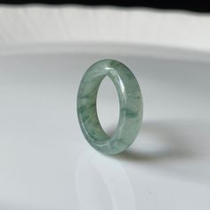 Untreated, Undyed, Authentic Natural Type A Burmese Jadeite Jade Handmade Band Ring ----------------------------------------------------- DETAIL SPECIFICATION ----------------------------------------------------- Inner Dia (內徑) : 17.1 mm (US size 6.75) Width (寬度) : 5.7 mm Thickness : 2.9 mm Weight : 3.5 g (17.5 ct) Color : Green Texture : Fine Transparency: Translucent Material : Fei Cui / Type A Jadeite jade/ Burma jadeite jade/ Natural Jadeite. Origin of Jade : Myanmar (Burma). ONLY ONE availa Classic Green Jade Jewelry, Modern Green Round Band Jewelry, Classic Round Jade Jewelry, Green Jade Round Band Jewelry, Modern Jade Ring As A Gift, Classic Green Jade Rings, Modern Green Emerald Ring, Green Jade Round Band Ring, Jadeite Ring