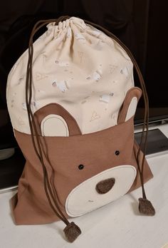 a drawstring bag sitting on top of a counter