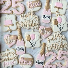 decorated birthday cookies are displayed on a table