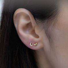 Such a cute, and dainty pair of earrings! They're perfect alone or stacked. They're a tiny pair that are perfect for second piercings, cartilage piercings, or for a minimalist touch. ✤✤ Details ✤✤ ★ Made of 925 Sterling Silver ☾ We use a THICK plating of 14k Gold or Rhodium for a piece that is sure to last you years to come ★ Sold as a PAIR ☾ Nickel-free & Hypoallergenic ★ Measures 5 mm x 4 mm ☾ We use the highest grade of cubic zirconia for an authentic diamond look Comes in a cute gift box Dainty Crescent Earrings For Everyday, Dainty Half Moon Charm Earrings, Dainty Half Moon Earrings With Moon Charm, Minimalist Moon Earrings For Everyday, Minimalist Moon-shaped Everyday Earrings, Dainty Crescent Cartilage Earrings As Gift, Dainty Moon Shaped Hypoallergenic Earrings, Dainty Hypoallergenic Moon-shaped Earrings, Dainty Moon-shaped Hypoallergenic Earrings