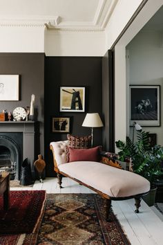 a living room filled with furniture and a fire place