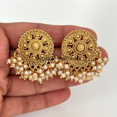 Antique Pearl Gold Studs Earrings /Indian Studs/Indian Earrings/Indian Jewelry/Pearl Stud/Bridal Jewelry/Indian wedding/South Indian Jewelry Style 1 Height = 38 Mm || Width = 30 Mm Style 2 Height = 35 Mm || Width = 34 Mm Style 3 Height = 32 mm || Width = 34 mm Style 4 Height = 32 mm || Width = 34 mm This is 100% Handmade jewelry. So Color, shades, texture displayed may slightly vary from the actual product due to digital image limitations. We request you to consider these minor variations. Please expect the possibility of some slight imperfections when buying handmade jewelry. If you have any questions, please message or email us. Arrives in a gift box. Please let me know if you have any questions. Thank you so much for visiting my shop. Temple Jewelry Style Pearl Drop Earrings, Festive Pearl Earrings, Round Temple Jewelry Pearl Drop Earrings, Temple Jewelry Round Pearl Drop Earrings, Traditional Pearl Drop Earrings, Festive Pearl Drop Earrings, Round Pearl Earrings For Temple Jewelry, Pearl Earrings For Celebrations In Temple Jewelry Style, Traditional Round Pearl Drop Earrings