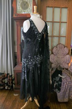 Black silk chiffon beaded Flapper dress, approx sizing from 4-8 (bias cut) Gown does include the matching beaded jacket. More pics on FB:https://www.facebook.com/pg/RetroVintageWeddings1920s1930s/photos/?tab=album&album_id=2623216997774327 Black Art Deco Flapper Dress With Sequins, Black Sleeveless Art Deco Dress, 1920s Black Embellished Dress, Black V-neck Flapper Dress For Evening, Vintage Black Flapper Dress With Beaded Fringe, Gatsby Wedding Dress, Beaded Flapper Dress, Deco Dress, Art Deco Dress