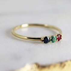 Dainty Three Stone Ring 14k Solid Gold, Sapphire, Ruby, Emerald Ring, Minimalist Ring, Colorful Gemstone Ring Material; ***14k solid gold band and prongs ***Stones are 2.5mm each, real sapphire, emerald and ruby. ***Prong settings. ***1.2mm band ***Can be personalize with any birthstone you choose. Please contact me. Thanks for visiting Melt'm Design Studio Three Birthstone Ring, 14k Gold Three Stone Round Band Jewelry, 14k Gold Multi-stone Stackable Rings, Three Stone 14k Gold Round Band Jewelry, Multi-stone 14k Gold Birthstone Ring, 14k Gold Multi-stone Birthstone Ring, 14k Gold Three-stone Emerald Ring As Gift, 14k Gold Multi-stone Stackable Rings For Anniversary, 14k Gold Multi-stone May Birthstone Ring