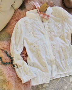 A gorgeous gauzy white cotton base has the sweetest soft polka dot details. Button front design with a soft breezy semi-sheer lace and sweetest long sleeve fit. So pretty for fall & winter. White Poly Imported Hand wash cold split Small Medium Large Bust 35 37 39 Waist 35 37 39 Hips 37 39 40 Length 25 25 26 Bust, waist, and hip measurements are a total circumference. Length is measured from the top of the blouse to the hem. Measurements are an estimate. Eyelet Blouse, Large Bust, Winter White, Front Design, Sheer Lace, Modest Fashion, White Cotton, Lace Top, Polka Dot