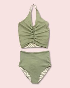 This darling tankini is basically four swimsuits in one (see the variations below). In our opinion, it is as cute as swimsuits come. The top has an added layer inside with sewn-in padding for worry-free play all day. It is high-quality, comfortable, and SO much fun!! Truly, a combination you won't want to live (or swim) without ;). High-waisted reversible bottoms (green terry cloth and zebra print) V-neck top with flattering cinched ruching Sewn-in padding Criss-cross adjustable back straps High Crochet Tankini, Baby Vitamins, Printed Tankini, Self Tanner, Tankini Set, Back Strap, Terry Cloth, Guys And Girls, Zebra Print