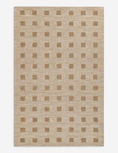 a beige rug with brown squares on it