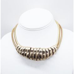 This is part of Chairish’s Costume Jewelry assortment.  1950s goldtone two snake chains with smooth spiral center collar necklace with hook clasp. Marked on the hook "Napier." Measures: 5 1/2 inches long by 5 inches wide. Center: 1 1/8 inches long. Interior circumference about 15 1/2 inches maybe as much as 16 inches maximum. Condition: Very good; minor surface wear. An identical necklace is shown on pg. 232 of Melinda L. Lewis & Henry Swen's book "The Napier Co.: Defining 20th Century American Gold Metal Snake Chain Choker, Metal Snake Chain Choker, Adjustable Gold Metal Snake Chain Necklace, Gold Slinky Metal Jewelry, Gold-tone Snake Chain Necklace, Book Pieces, Hook Clasp, Modern Branding, Accessories Jewelry Necklace