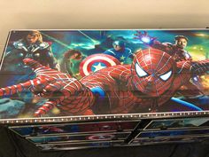 an open box with the avengers movie poster on it