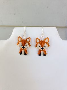 the beaded fox earrings are on display