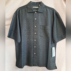 Shirt Is In New, Never Used Condition, With Original Tag Still Attached. Great For Those Hot Summer Days Or Simply For A Casual Outing - Brand: Batik Bay - Color: Black - Size: Small - Material: 73% Rayon/ 27% Polyester >> I Am Open To All Reasonable Offers Also Bundle 2 Items Or More And Receive 15% Off Your Total Purchase Price Casual Black Short Sleeve Shirt With Button Closure, Casual Black Hawaiian Shirt With Camp Collar, Casual Black Camp Shirt With Button Closure, Black Camp Shirt With Buttons, Casual Black Button-up Camp Shirt, Black Relaxed Fit Camp Shirt With Button Closure, Classic Black Button-up Camp Shirt, Black Button-up Hawaiian Shirt For Beach, Casual Black Button-up Hawaiian Shirt