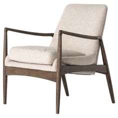 the chair is made from wood and has a beige fabric upholstered backrest