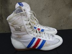 Vintage 1985 Adidas Rocky Boxing, White with Red & Blue Trim, Mint UK 6.5 | US 7 Awesome Shoes  check photos for a more detailed description. PLEASE VIEW ALL PHOTOS CAREFULLY AS I CONSIDER THEM PART OF THE DESCRIPTION. I WILL GLADLY COMBINE SHIPPING FOR MULTIPLE ITEMS PURCHASED IF THEY CAN BE SAFELY SHIPPED TOGETHER. DELIVERY WITHIN 3-4 BUSINESS DAYS, 1-2 BUSINESS DAY HANDLING. ONCE YOUR PAYMENT CLEARS, THIS ITEM WILL COME PROFESSIONALLY PACKAGED AND SHIPPED WITH CARE. PLEASE CONTACT ME THROUGH MESSAGES IF YOU HAVE ANY QUESTIONS OR CONCERNS. THANKS FOR LOOKING Rocky Boxing, Boxing Shoes, Awesome Shoes, Sneakers Athletic, Blue Trim, Nice Shoes, Kenya, Festival Season, Rocky