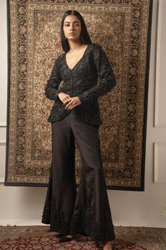 Black full sleeve jacket with cutdana, bead, sequin embroidery in floral pattern. Paired with palazzo. - Aza Fashions Elegant Bandhgala For Designer Wear In Fall, Traditional Party Sets For Fall, Embellished Georgette Palazzo Set With Long Sleeves, Elegant Festive Outerwear With Mirror Work, Bollywood Embellished Long Sleeve Palazzo Set, Traditional Fall Party Sets, Black Long-sleeved Palazzo Set With Dabka Work, Black Embroidered Traditional Drape Palazzo Set, Embroidered Black Georgette Palazzo Set