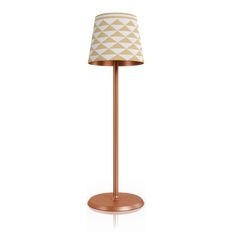 a lamp with a white and gold shade on it's base, against a white background