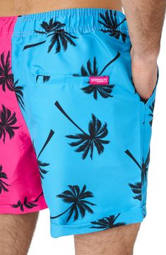 A 2-piece set features a bright and bold palm graphic on a button-up shirt and matching drawstring shorts. 2-piece set Top has notch collar, short sleeves Shorts have elastic drawstring waistband 100% polyester Machine wash, line dry Imported Model stats: 6'1" height, 32" waist. Model is wearing size M. Summer Pink Swimwear With Graphic Print, Pink Graphic Print Shorts For Summer, Summer Short Swimwear With Graphic Print, Summer Graphic Print Short Swimwear, Printed Cotton Swim Trunks For Vacation, Casual Palm Tree Print Swimwear For Spring, Spring Casual Swimwear With Palm Tree Print, Casual Spring Swimwear With Palm Tree Print, Casual Blue Swimwear With Graphic Print