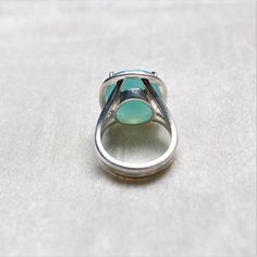 D E T A I L S - Material: 925 Sterling silver Stone: Aqua Chalcedony The fit: True to US ring size Finish: Smooth and polished to a high shine S H I P P I N G & P R O D U C T I O N - My current production time is 2-6 business days, which means after those days are up, your order ships! I make everything custom to order, by hand, but I promise you it's worth the wait! R U S H - M Y - O R D E R - If you're in a rush to get your pretty new pieces, please send me a message and I'll let you know Elegant Turquoise Moonstone Ring In Sterling Silver, Classic Chalcedony Rings As Gift, Silver Oval Chalcedony Rings, Oval Silver Chalcedony Ring, Anniversary Chalcedony Ring With Polished Finish, Silver Chalcedony Rings For Anniversary, Aqua Chalcedony Ring, Ring Everyday, Chalcedony Ring