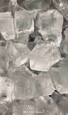 some ice cubes are sitting on top of each other