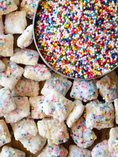 sprinkles and sugar cubes next to a spoon