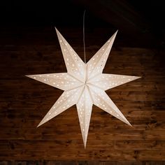 a large white star hanging from the ceiling