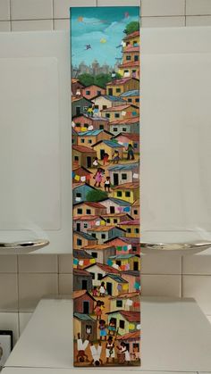 a painting on the side of a stove in a kitchen