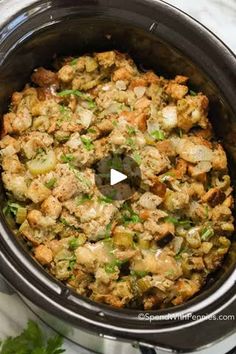 the crock pot is filled with stuffing and vegetables to make it look like an appetizer