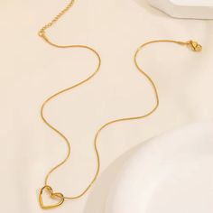 Mini Hollow Twist Heart Pendant Necklace – 18K Gold Plated Stainless Steel Chain for Women and Girls Discover the charm of our Mini Hollow Twist Heart Pendant Necklace. This elegant piece features a delicate heart pendant with a unique twist design, plated in 18K gold on a durable stainless steel chain. Perfect for women and girls who adore minimalist and aesthetic jewelry, this necklace is a standout accessory for any occasion. Ideal for enhancing your everyday look or adding a touch of sophist Mother's Day Double Heart Gold Plated Necklace, Gold Plated Double Heart Necklace, Gold Plated Open Heart Necklace For Mother's Day, Mother's Day Gold Plated Open Heart Necklace, Mother's Day Open Heart Gold Plated Necklace, Gold Plated Tarnish Resistant Heart Necklace For Mother's Day, Minimalist Gold Plated Double Heart Necklace, Minimalist Double Heart Gold Plated Necklace, Valentine's Day Gold Plated Heart Necklace With Adjustable Chain