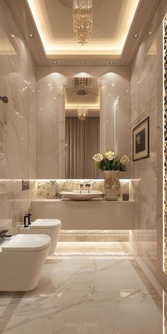 a bathroom with two toilets and a tub in it's center, along with a chandelier hanging from the ceiling