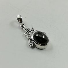 ▪︎ A black onyx stone mounted on a victorian style sterling silver frame to make a beautiful pendant. ▪︎ Size: 15 x 24 mm. Stone: 12 x19 ▪︎ This is a multi functional charm and can be used with neck chains, ear hoops, bracelets, anklets, key chains etc. ▪︎ This pendant is handmade with hypoallergenic sterling silver, and is nickel free. Comes with a 925 mark for authenticity. ▪︎ Please note: Price listed is for ONE charm. This pendant comes WITHOUT the chain, however, you can add a snake neck ch Black 925 Stamped Pendant Jewelry, Silver Onyx Jewelry With Large Stone, Silver Onyx Oval Pendant Jewelry, Silver Onyx Oval Pendant, Egyptian Necklace, Tibetan Jewelry, Victorian Pendants, Silver Eye, Neck Jewellery