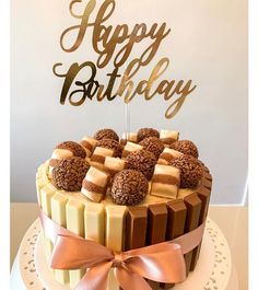 a birthday cake decorated with chocolate and marshmallows