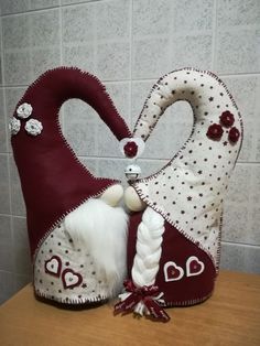 a decorative heart shaped bag with white hair