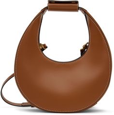 Structured buffed leather shoulder bag in brown. · Carry handle with detachable logo-embossed strap pad · Adjustable and detachable pin-buckle shoulder strap · Press-stud closure · Zip pocket at interior · Suede lining · Contrast stitching in white · H10.5 x W9 x D3 in Supplier color: Tan | STAUD Brown Mini Moon Bag Staud Mini Moon, Moon Bag, Mini Moon, Press Studs, Contrast Stitch, Rebecca Minkoff Hobo, Leather Shoulder Bag, Zip Pockets, Shoulder Strap