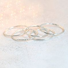 Minimalists rejoice over this dainty, sterling silver stacking ring. Smooth and shiny, made to order in your size! Any of our sterlings silver or gold stacking rings are just right for wearing alone, as a knuckle ring or as a set. This ring makes a lovely wedding band. This slim stacking band is also available in yellow gold or rose gold filled, or 14k solid yellow, rose or white gold (separate listings!). See additional links below for more metal options and ring styles. ►More stacking rings in Silver Dainty Stackable Toe Rings, Dainty Sterling Silver Stackable Toe Rings, Dainty Stackable Rings With Simple Design, Simple Open Stackable Rings, Dainty Sterling Silver Midi Rings, Dainty Stackable Midi Rings, Dainty Stackable Open Midi Rings, Stackable Dainty Midi Rings, Dainty Stackable Midi Rings With Round Band