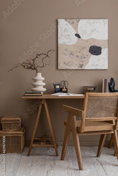 two wooden chairs sitting in front of a desk