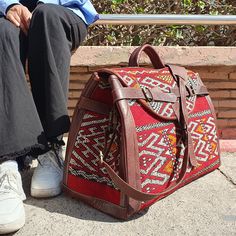 Need a practical yet ultra-stylish travel bag? Get Bag designed with a carpet pattern, this leather bag boasts plenty of style and large capacity. Duffel Carpet Bag With a leather base, protective metal feet, single leather handle. A stunning Overnight bag from our dazzling collection of authentic and stylish Large weekender bag crafted in Marrakech. Handmade and carved, functional, and perfect for all your travels. Meets carry-on requirements & stows neatly in overhead. >> The features of this Traditional Rectangular Weekender Bag For Travel, Traditional Rectangular Duffle Bag For Travel, Vintage Rectangular Satchel For Weekend Trips, Vintage Rectangular Weekender Bag For Weekend Trips, Traditional Satchel For Travel, Bohemian Rectangular Bag For Overnight Trips, Traditional Travel Bags With Leather Handles, Traditional Tote Weekender Bag For Travel, Traditional Rectangular Satchel For Travel