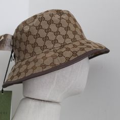 Product Description Gucci Reversible Bucket Hat Wool In A Close Weave Flat Crown Dropped Brim Front Logo Patch All-Over Check Motif All-Over Logo-Jacquard Motif At Reverse Made In Italy Brown Leather Trim Double G Made In Italy Gucci Adjustable Bucket Hat, Gucci Brown Short Brim Hat, Designer Beige Flat Brim Hat, Designer Brown Hat With Short Brim, Designer Wide Brim Beige Hats, Designer Beige Wide Brim Hat, Designer Beige Adjustable Hat, Designer Adjustable Beige Hat, Gucci Adjustable Brimmed Hat