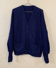 Vintage Navy Blue Fuzzy Wool Shaggy Curt Cobain? Cardigan Sweater Size M / L. Nice worn in 90’s grunge style. Item does show signs of wear but no tears or stains. Unofficial size M/L no tags. Please double double check measurements for sizes may vary vary. Message for pics and additional questions. Measurements done while item lays flat out. 27in top shoulder down 22in armpit to armpit 27in sleeve to shoulder Vintage Blue Cotton Cardigan, Blue Long Sleeve Vintage Cardigan, Blue Wool Casual Cardigan, Classic Blue Sweater With Pockets, Blue Wool Long Sleeve Cardigan, Classic Blue Long Sleeve Cardigan, Classic Long Sleeve Blue Cardigan, 90’s Grunge, Grunge Style