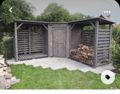 an outdoor firewood storage shed with logs stacked in the back and doors open on either side