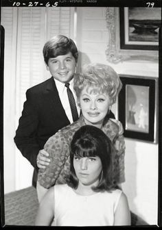 an old black and white photo of two people with one woman holding the other's hair