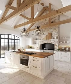 a large kitchen with an island counter top and wooden beams on the ceiling above it