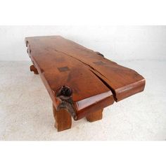 an old wooden bench sitting on top of a white floor