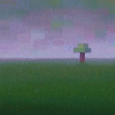 a blurry image of a tree in the middle of a grassy field with fog