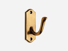 an antique brass door handle on a white background