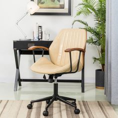 an office chair sitting on top of a rug next to a desk with a lamp