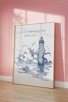 a framed photo with a lighthouse on it in front of pink walls and wood flooring