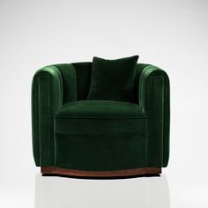 a green velvet chair with two pillows on it's back and the seat upholstered